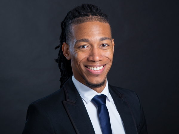 Natural and friendly professional photo for NYC real estate broker in portrait studio