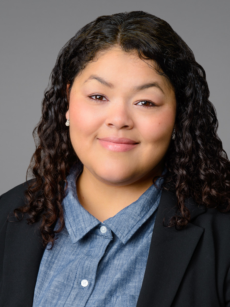 Female applicant headshot for medical residency application, light gray studio backdrop