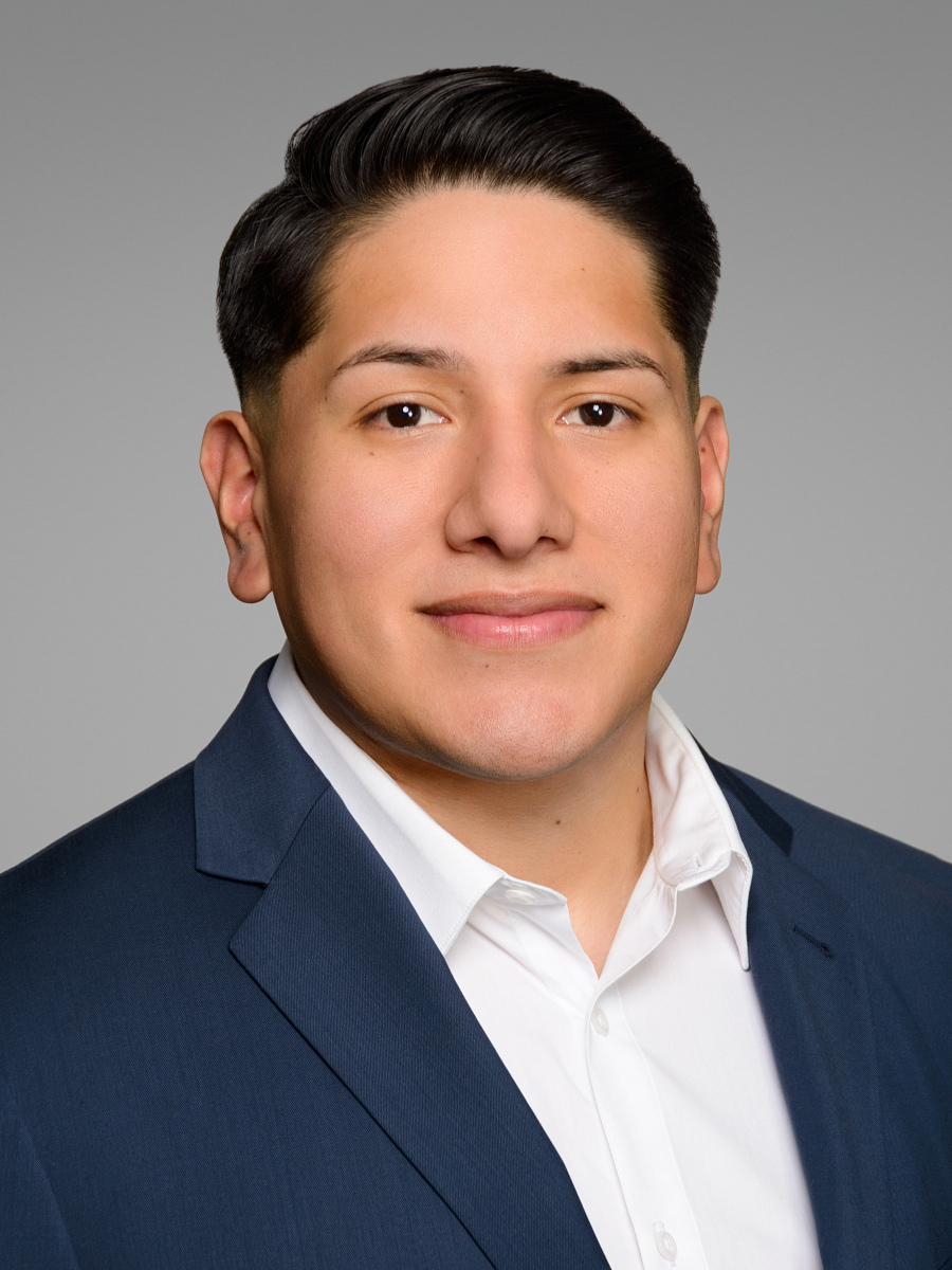 Astoria Queens NYC male realtor headshot, light gray studio background, real estate agent