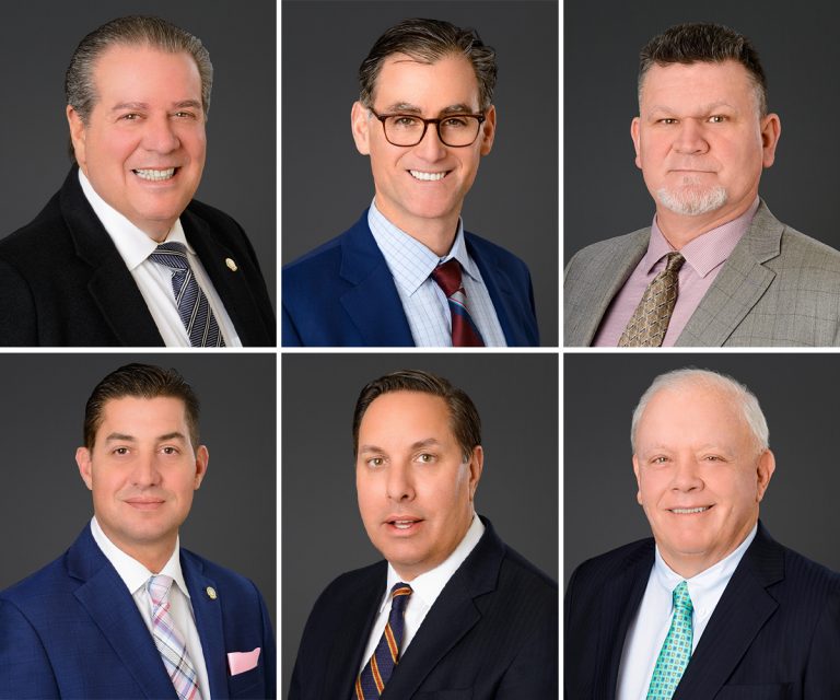 Executive corporate headshot against a dark background, NYC corporate photographer